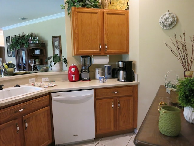 1799 W Shanelle Path, Lecanto, FL 34461 - kitchen with white dishwasher, ornamental molding, light countertops, light tile patterned flooring, and brown cabinets