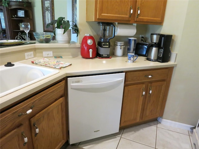 1799 W Shanelle Path, Lecanto, FL 34461 - kitchen featuring white dishwasher, brown cabinets, light countertops, and light tile patterned floors
