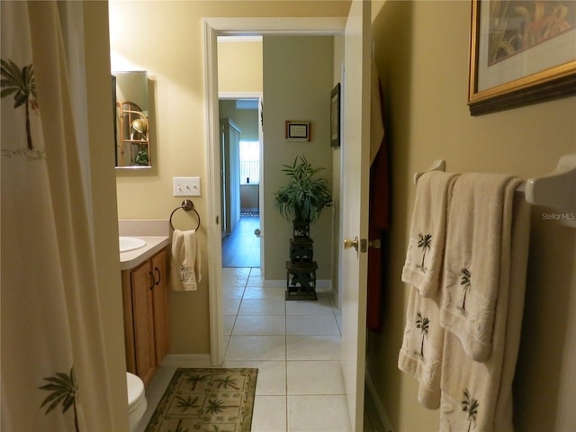 1799 W Shanelle Path, Lecanto, FL 34461 - bathroom with tile patterned flooring, vanity, toilet, and baseboards