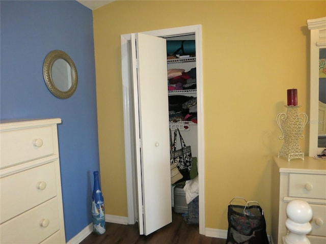 1799 W Shanelle Path, Lecanto, FL 34461 - bedroom featuring dark wood-type flooring, a closet, and baseboards