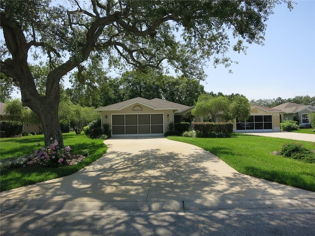 1799 W Shanelle Path, Lecanto, FL 34461 - ranch-style house with concrete driveway, a front lawn, an attached garage, and stucco siding
