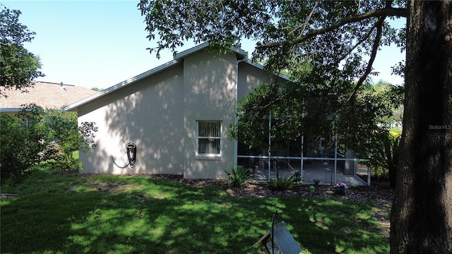 1799 W Shanelle Path, Lecanto, FL 34461 - view of side of property featuring a yard and stucco siding