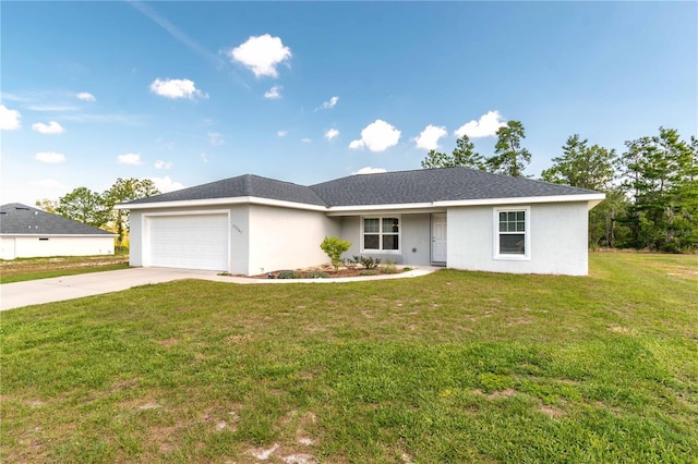 13561 SW 85th Pl, Dunnellon, FL 34432 - ranch-style home featuring a garage, driveway, a front yard, and stucco siding