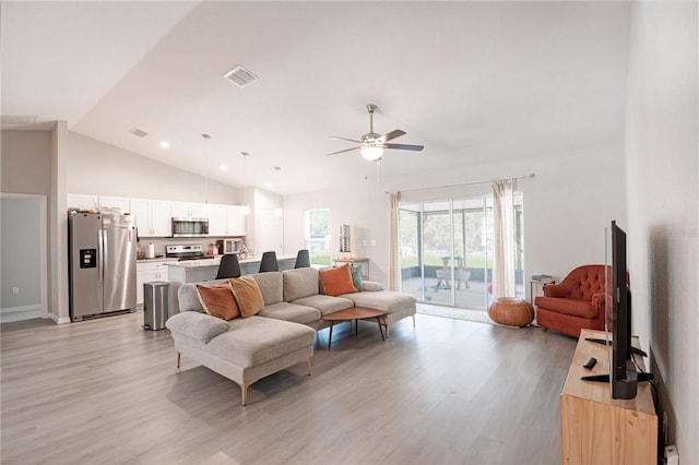 13561 SW 85th Pl, Dunnellon, FL 34432 - living room featuring ceiling fan, light wood-type flooring, and high vaulted ceiling