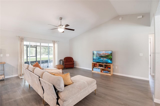 13561 SW 85th Pl, Dunnellon, FL 34432 - living room featuring lofted ceiling, a ceiling fan, wood finished floors, and baseboards