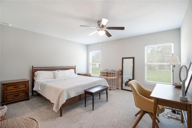 13561 SW 85th Pl, Dunnellon, FL 34432 - bedroom featuring light carpet, a ceiling fan, and a desk