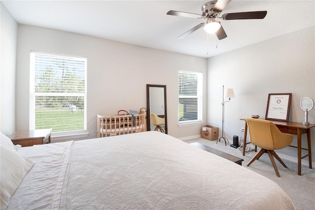 13561 SW 85th Pl, Dunnellon, FL 34432 - bedroom with carpet flooring, baseboards, and a ceiling fan