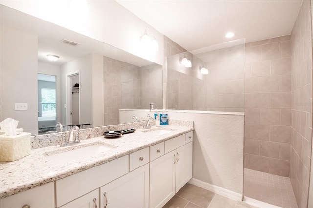 13561 SW 85th Pl, Dunnellon, FL 34432 - full bathroom featuring connected bathroom, double vanity, walk in shower, and tile patterned flooring