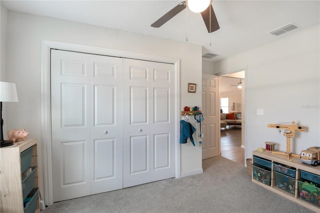 13561 SW 85th Pl, Dunnellon, FL 34432 - bedroom with a closet, carpet, and a ceiling fan