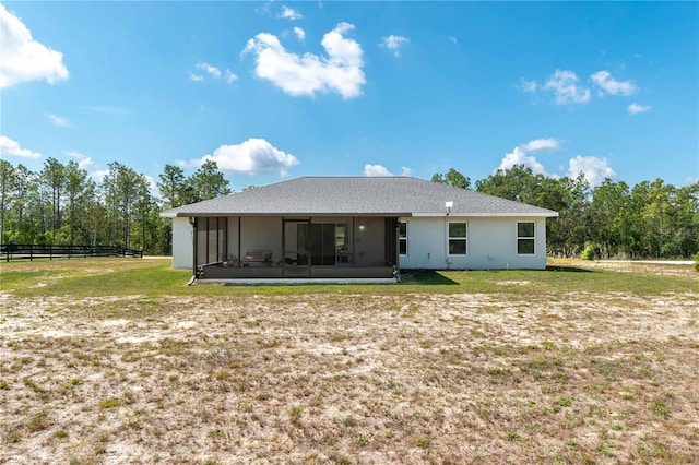 13561 SW 85th Pl, Dunnellon, FL 34432 - back of house with a sunroom and stucco siding