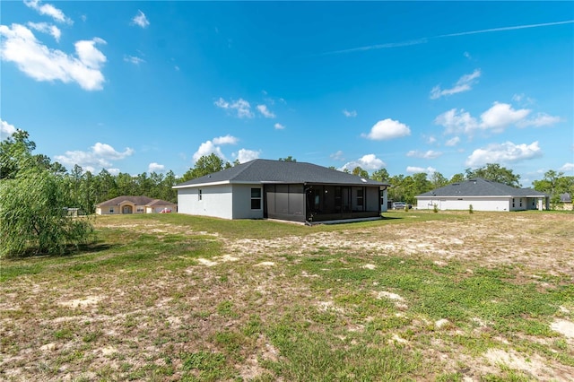 13561 SW 85th Pl, Dunnellon, FL 34432 - back of property featuring a sunroom and a yard