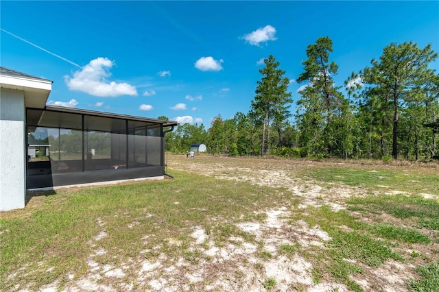 13561 SW 85th Pl, Dunnellon, FL 34432 - view of grassy yard featuring a sunroom
