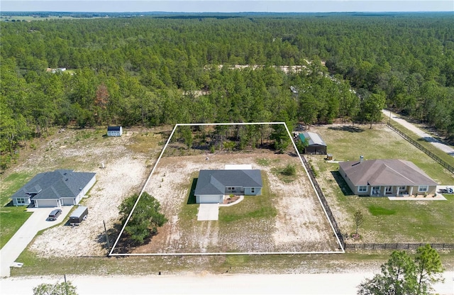 13561 SW 85th Pl, Dunnellon, FL 34432 - aerial view of property and surrounding area featuring a heavily wooded area and property boundaries highlighted