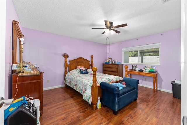 9661 SW 95th Ct Unit B, Ocala, FL 34481 - bedroom featuring wood finished floors, baseboards, a textured ceiling, and ceiling fan