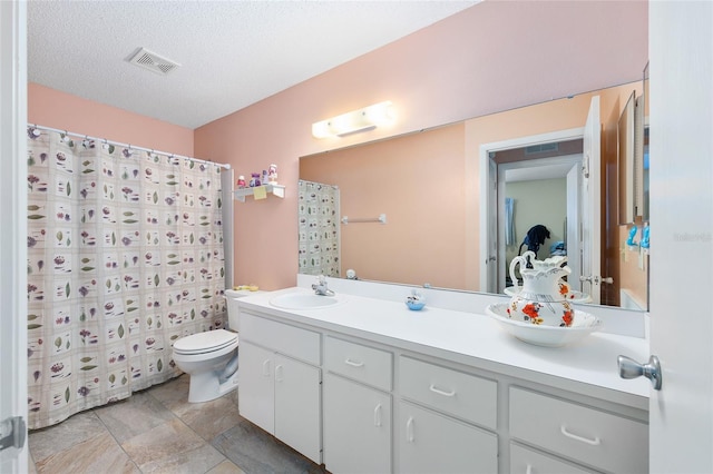 9661 SW 95th Ct Unit B, Ocala, FL 34481 - full bath with toilet, vanity, curtained shower, and a textured ceiling