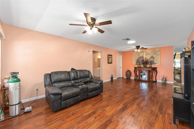 9661 SW 95th Ct Unit B, Ocala, FL 34481 - living area featuring a ceiling fan, wood finished floors, a textured ceiling, and baseboards