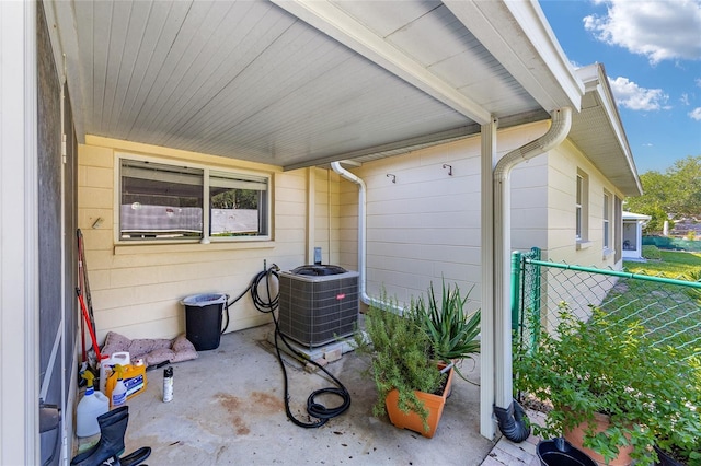 9661 SW 95th Ct Unit B, Ocala, FL 34481 - view of patio / terrace with central AC unit and fence