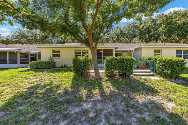 9661 SW 95th Ct Unit B, Ocala, FL 34481 - ranch-style house featuring a sunroom and a front yard