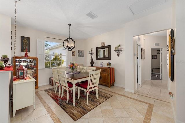 9663 SW 92nd Place Rd, Ocala, FL 34481 - dining room featuring inlaid floor details, baseboards, and light tile patterned floors