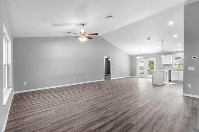 unfurnished living room featuring lofted ceiling, dark wood finished floors, ceiling fan, baseboards, and recessed lighting