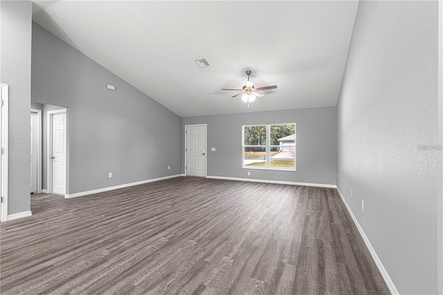 unfurnished living room with lofted ceiling, wood finished floors, a ceiling fan, and baseboards