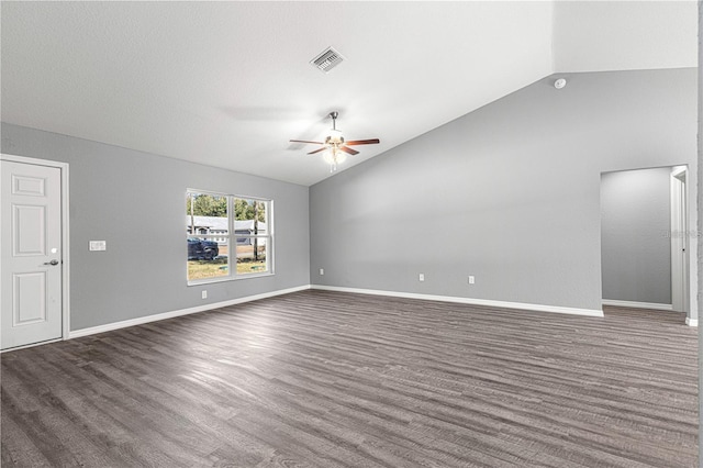 spare room with lofted ceiling, ceiling fan, wood finished floors, and baseboards