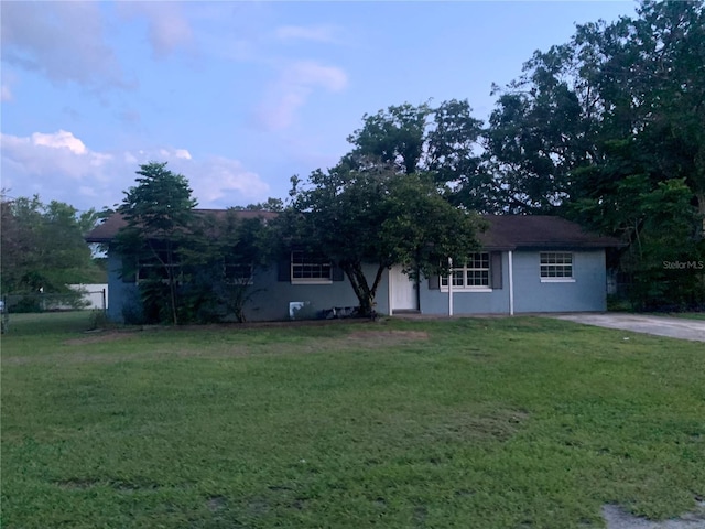 1912 NE 50th St, Ocala, FL 34479 - view of front of home featuring a front yard and stucco siding