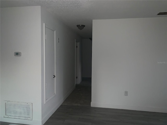1912 NE 50th St, Ocala, FL 34479 - corridor with wood finished floors and a textured ceiling
