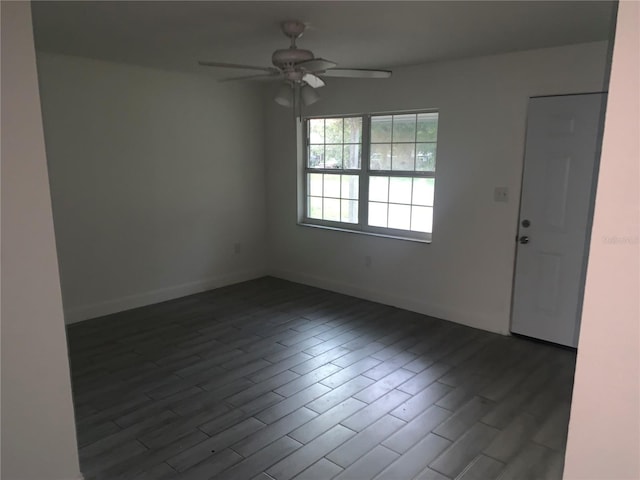 1912 NE 50th St, Ocala, FL 34479 - empty room featuring ceiling fan and dark wood-style flooring