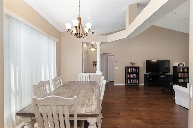 8053 SW 62nd Ave, Ocala, FL 34476 - dining room featuring arched walkways, wood finished floors, vaulted ceiling, a chandelier, and ornate columns