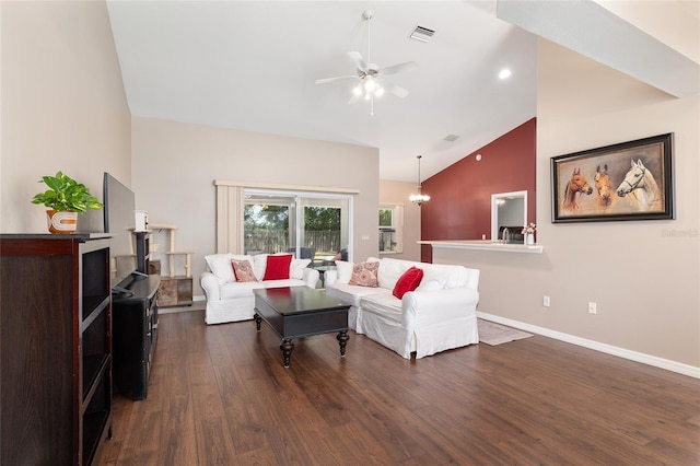 8053 SW 62nd Ave, Ocala, FL 34476 - living area with a ceiling fan, dark wood-style flooring, high vaulted ceiling, baseboards, and a chandelier