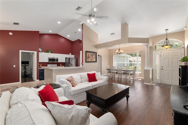 8053 SW 62nd Ave, Ocala, FL 34476 - living room with ornate columns, baseboards, a chandelier, high vaulted ceiling, and light wood-style floors