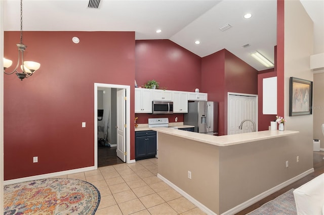 8053 SW 62nd Ave, Ocala, FL 34476 - kitchen featuring appliances with stainless steel finishes, high vaulted ceiling, white cabinetry, baseboards, and light countertops
