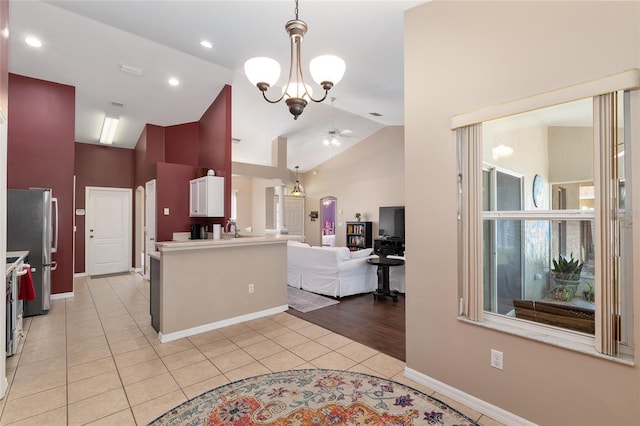 8053 SW 62nd Ave, Ocala, FL 34476 - kitchen with light tile patterned flooring, a ceiling fan, light countertops, hanging light fixtures, and open floor plan