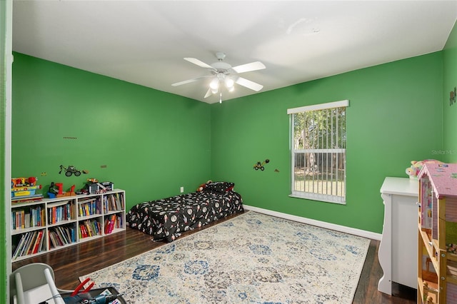 8053 SW 62nd Ave, Ocala, FL 34476 - bedroom with wood finished floors, baseboards, and ceiling fan