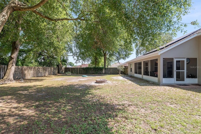 8053 SW 62nd Ave, Ocala, FL 34476 - view of yard with an outdoor fire pit and a sunroom