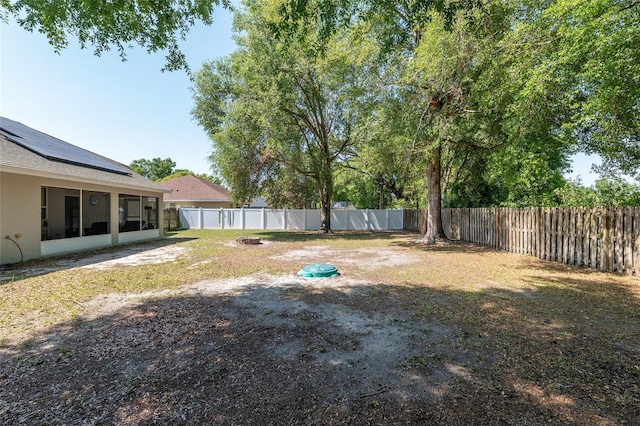8053 SW 62nd Ave, Ocala, FL 34476 - fenced backyard with a sunroom