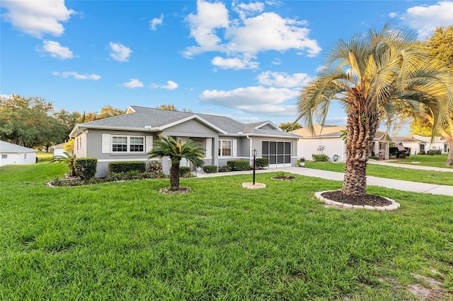 9729 SW 97th St, Ocala, FL 34481 - ranch-style house featuring driveway, stucco siding, an attached garage, and a front lawn