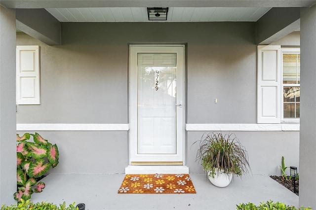 9729 SW 97th St, Ocala, FL 34481 - property entrance with stucco siding