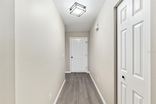9729 SW 97th St, Ocala, FL 34481 - hallway with wood finished floors and baseboards