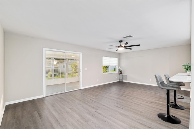 9729 SW 97th St, Ocala, FL 34481 - unfurnished office with a ceiling fan, wood finished floors, and baseboards