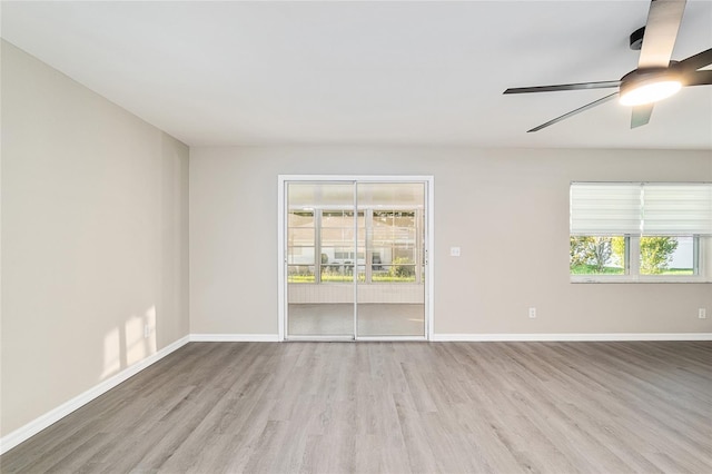 9729 SW 97th St, Ocala, FL 34481 - unfurnished room with wood finished floors, healthy amount of natural light, and baseboards
