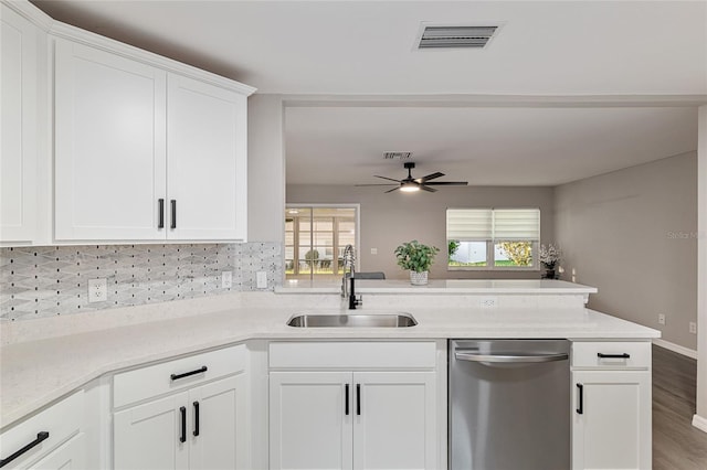 9729 SW 97th St, Ocala, FL 34481 - kitchen featuring stainless steel dishwasher, a sink, a peninsula, decorative backsplash, and ceiling fan