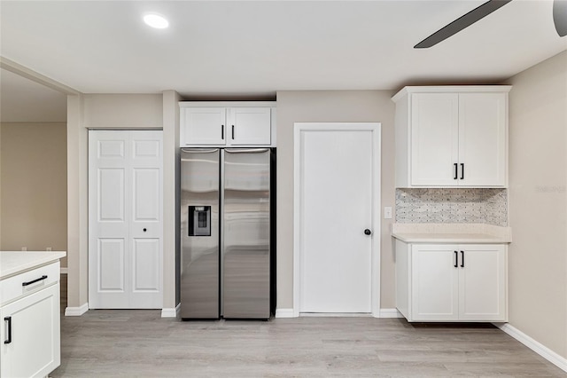 9729 SW 97th St, Ocala, FL 34481 - kitchen featuring stainless steel fridge, a ceiling fan, white cabinetry, light countertops, and light wood finished floors