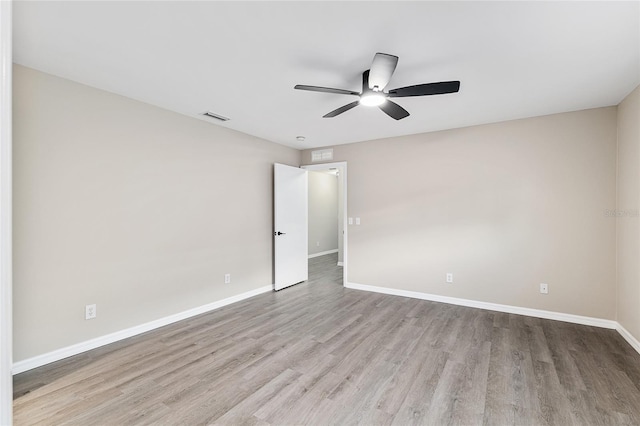 9729 SW 97th St, Ocala, FL 34481 - unfurnished room featuring wood finished floors, a ceiling fan, and baseboards