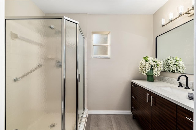 9729 SW 97th St, Ocala, FL 34481 - full bath with a shower stall, wood finished floors, vanity, and baseboards