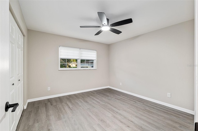 9729 SW 97th St, Ocala, FL 34481 - unfurnished bedroom featuring a closet, wood finished floors, baseboards, and ceiling fan