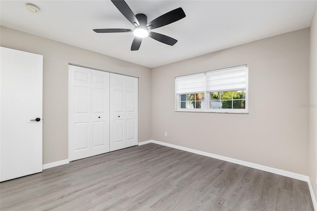 9729 SW 97th St, Ocala, FL 34481 - unfurnished bedroom with wood finished floors, baseboards, and a closet