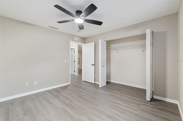 9729 SW 97th St, Ocala, FL 34481 - unfurnished bedroom featuring wood finished floors, baseboards, ceiling fan, and a closet