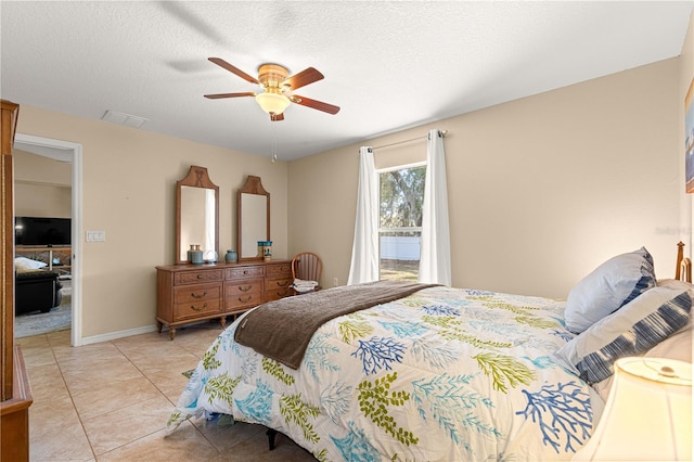 bedroom with light tile patterned floors and ceiling fan